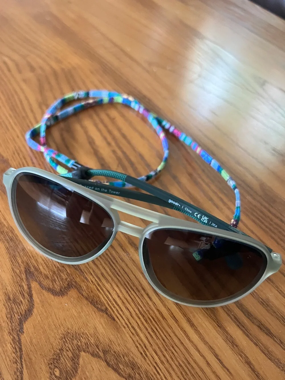 Goodr Buzzed on the Tower Mach G green sunglasses & chums retainer strap unisex